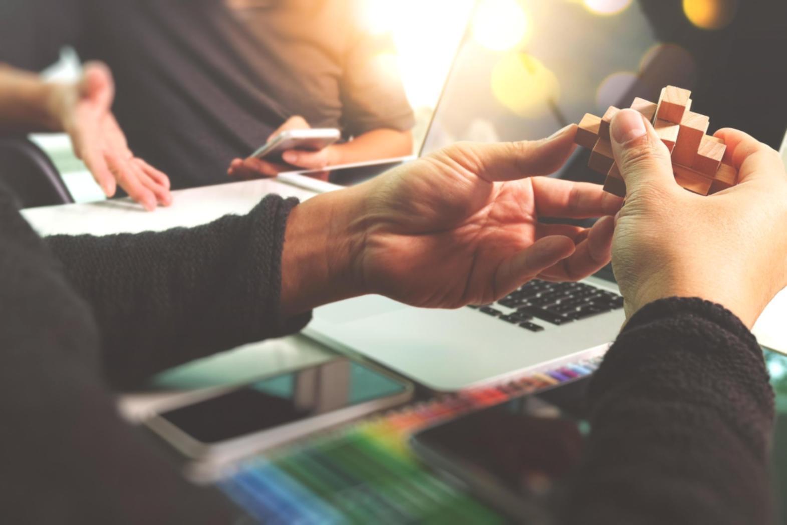 Finance professional reviewing automated compliance reports on multiple screens